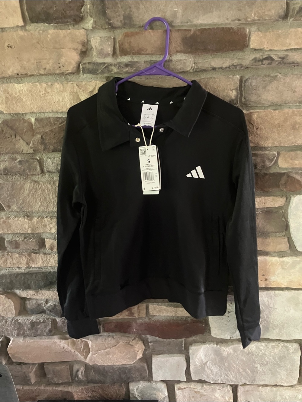Adidas Women's Iconic 3-Stripes Snap Track Top with a polo collar